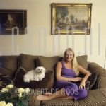 Christine van der Horst (Date Unknown) at home.

[keywords]Posed, Full Length, Eyecontact, Smiling, Dog, Paintings[/keywords]